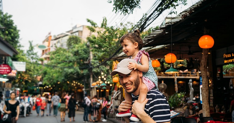 Thailand, Bangkok, portrait of smiling father and daughter on Khao San Road